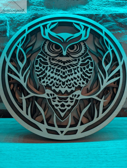Décoration murale hibou en bois 3D conçue par gravure laser pour un intérieur bohème chic. 